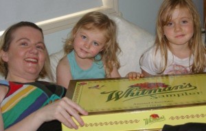 Cheryse Durrant with her two youngest fans, after she was discharged from hospital. Yes, that is a 1kg box of chocolates!
